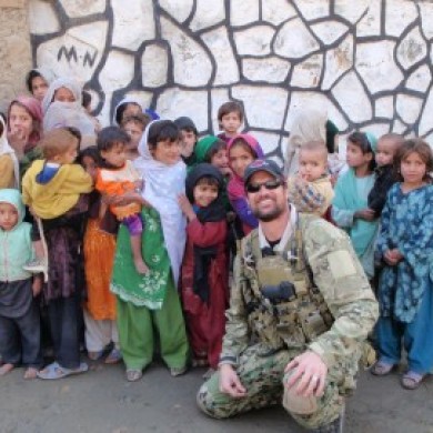 Adam with a group of Afghan children